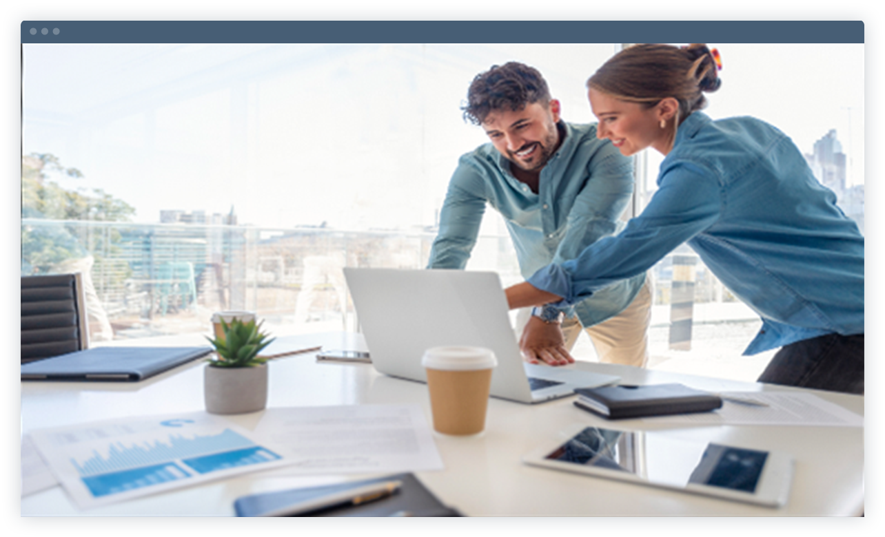 Laptop is showing two employees are discussing
