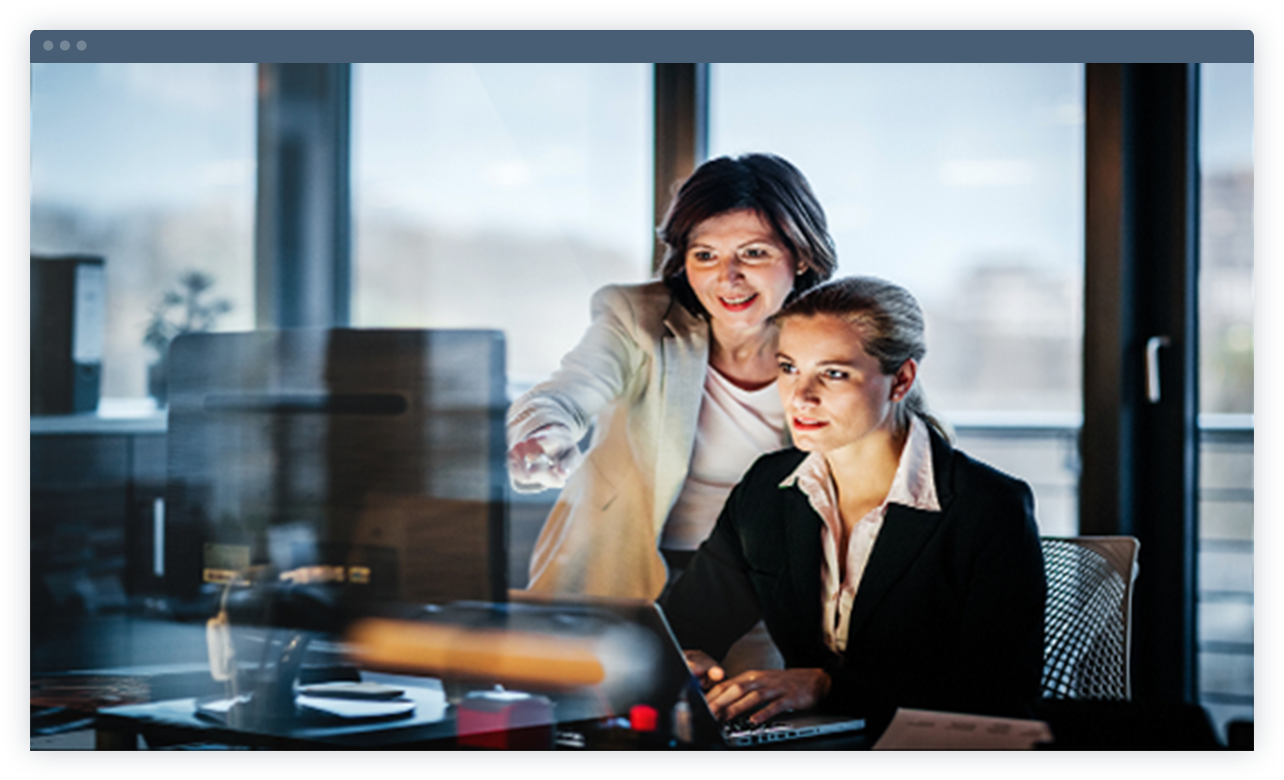 Laptop is showing two employees are discussing